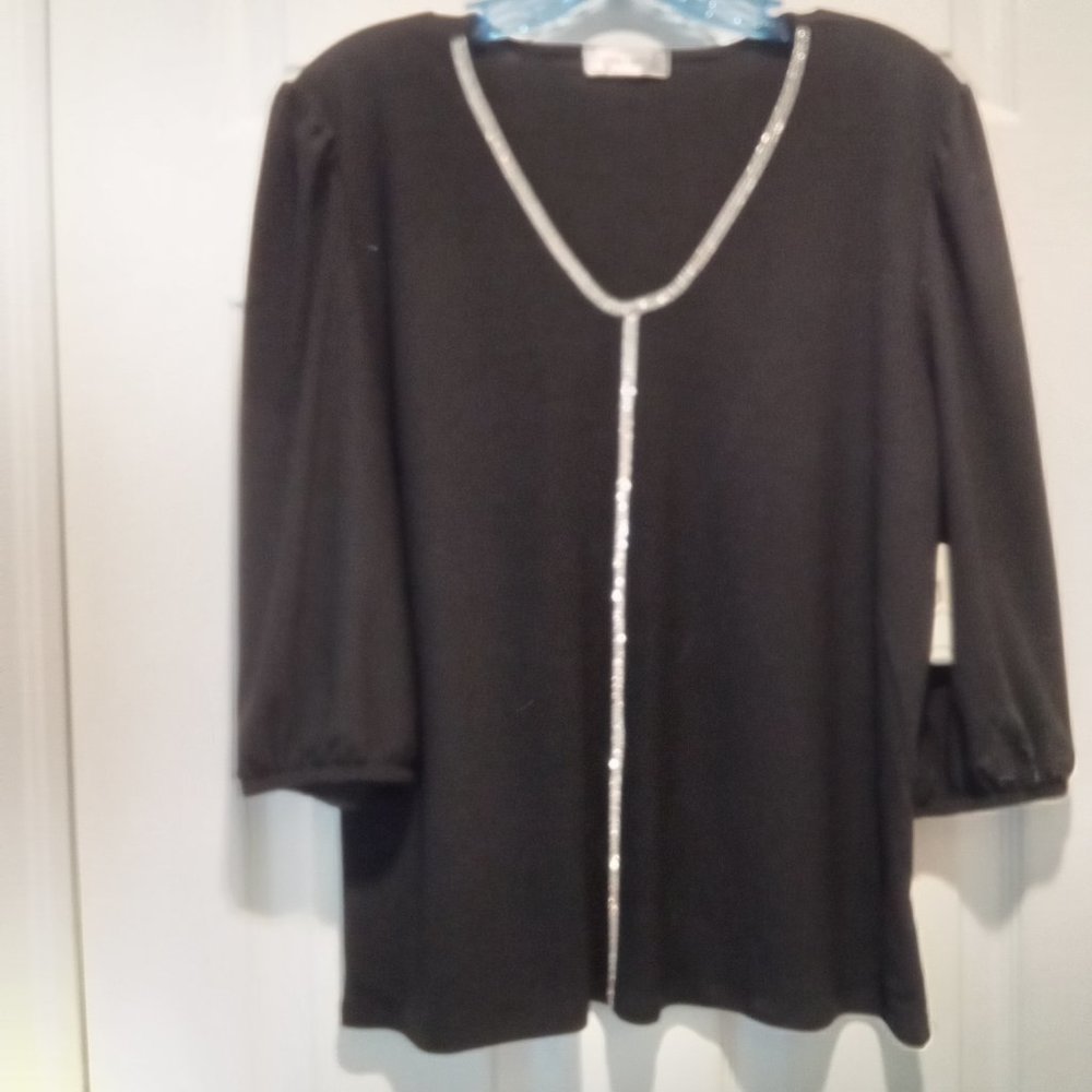 Black long sleeve top with accents